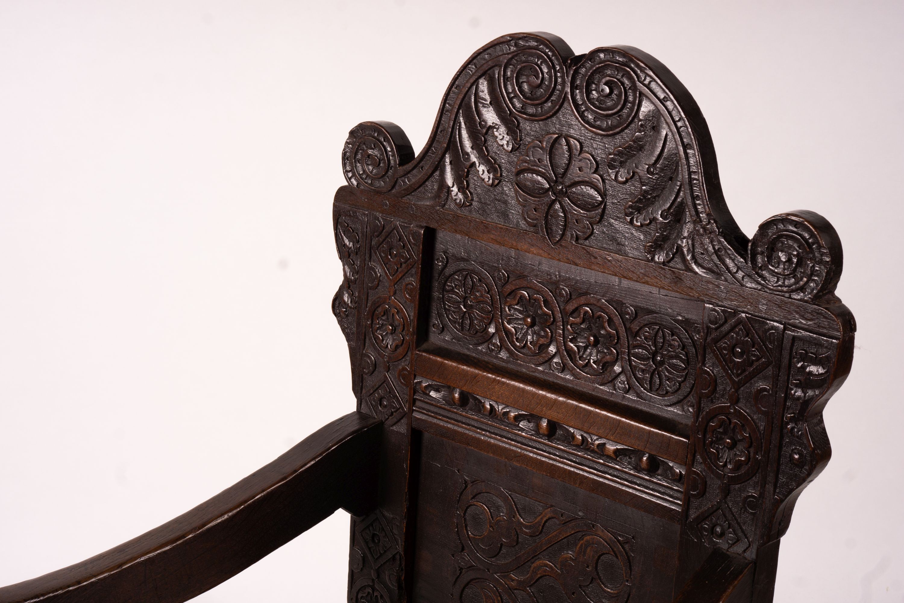 A 17th century Yorkshire area carved oak wainscot chair, width 62cm, depth 48cm, height 118cm